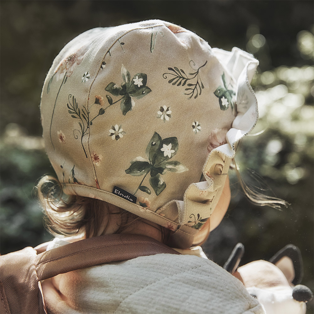 Elodie Winter Bonnet – zimska kapica za bebe 0–3m, Meadow Blossom